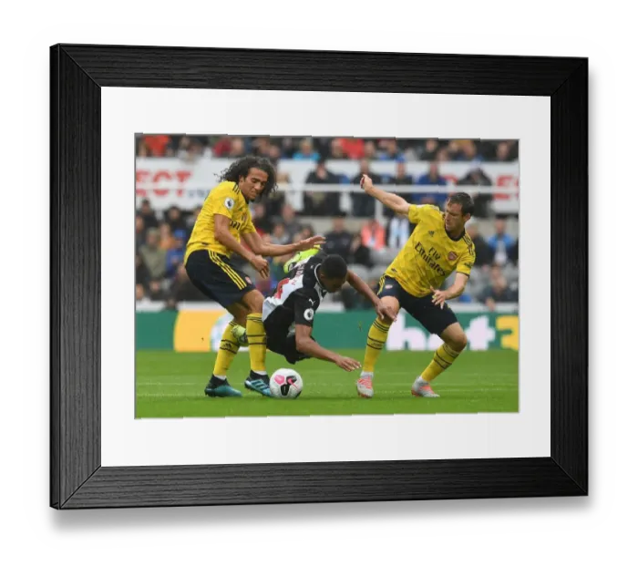 Framed Print : Arsenal vs Newcastle: Intense Battle between Guendouzi, Monreal and Hayden