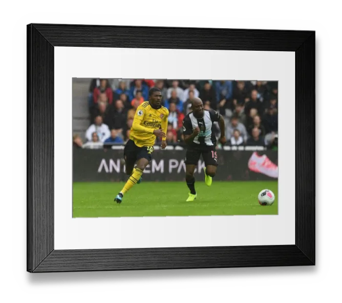 Framed Print : Maitland-Niles vs. Willems: Battle at St. James Park - Arsenal vs. Newcastle United, Premier League 2019-20