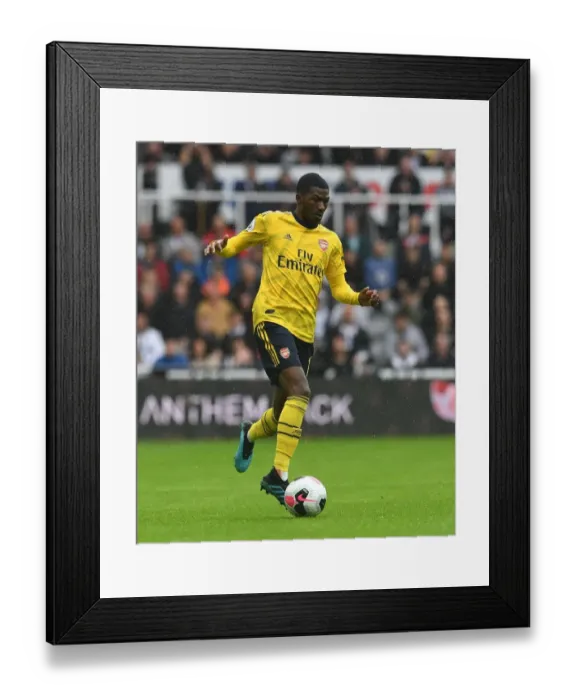 Framed Print : Ainsley Maitland-Niles in Action: Newcastle United vs Arsenal FC, Premier League 2019-20
