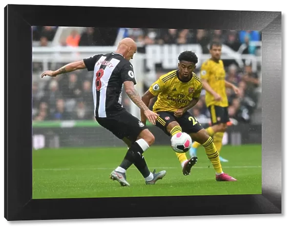 Arsenal's Nelson Faces Shelvey Pressure in Newcastle Clash (Premier League 2019-20)