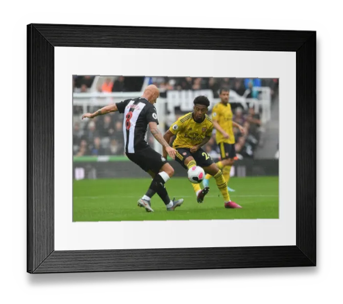 Framed Print : Arsenal's Nelson Faces Shelvey Pressure in Newcastle Clash (Premier League 2019-20) Framed Print : Arsenal's Nelson Faces Shelvey Pressure in Newcastle Clash (Premier League 2019-20)