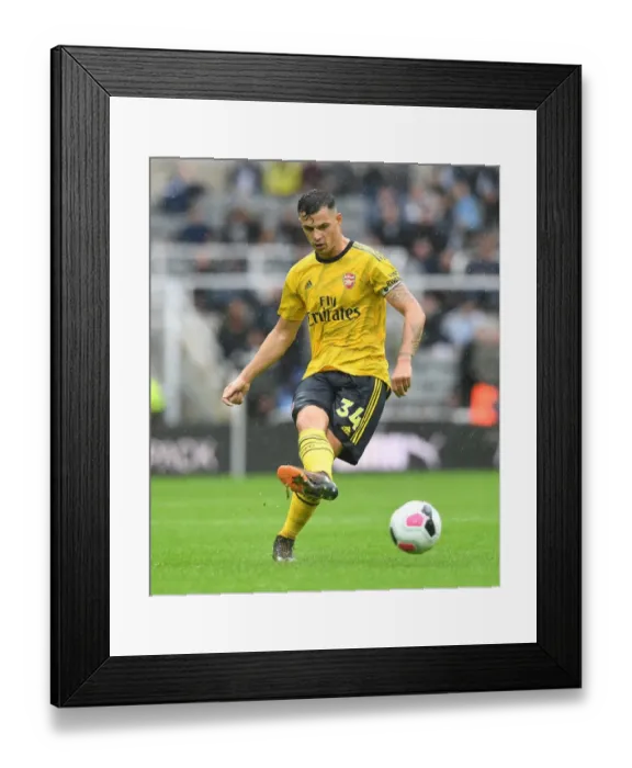 Framed Print : Granit Xhaka's Brilliant Midfield Performance: Arsenal Triumphs Over Newcastle United