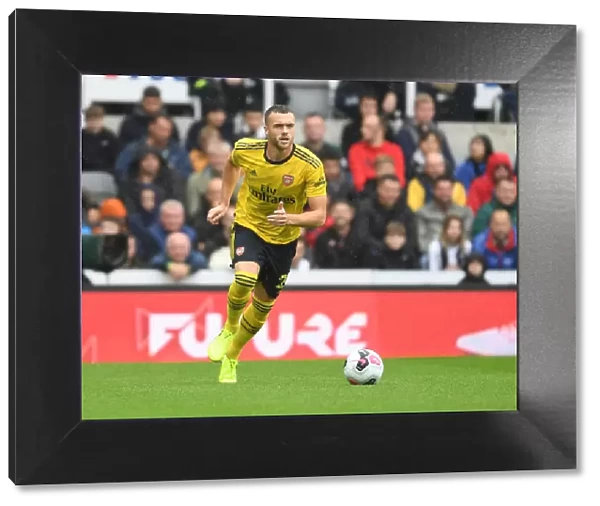 Arsenal's Calum Chambers in Action against Newcastle United - Premier League 2019-20