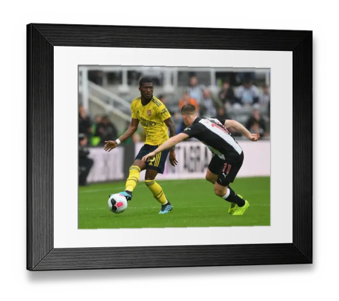 Framed Print : Maitland-Niles vs Ritchie: Battle at St. James Park - Newcastle United vs Arsenal FC, Premier League 2019-20