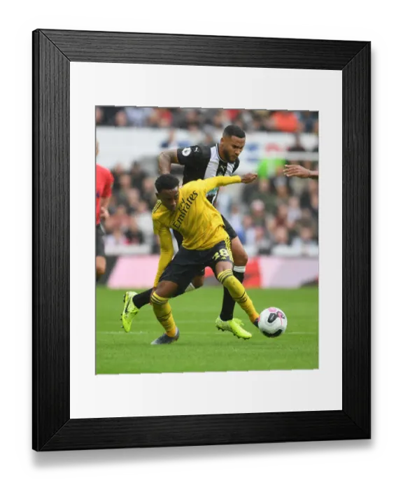 Framed Print : Intense Rivalry: Joe Willock vs Jamaal Lascelles Battle - Arsenal FC vs Newcastle United Premier League Clash Framed Print : Intense Rivalry: Joe Willock vs Jamaal Lascelles Battle - Arsenal FC vs Newcastle United Premier League Clash