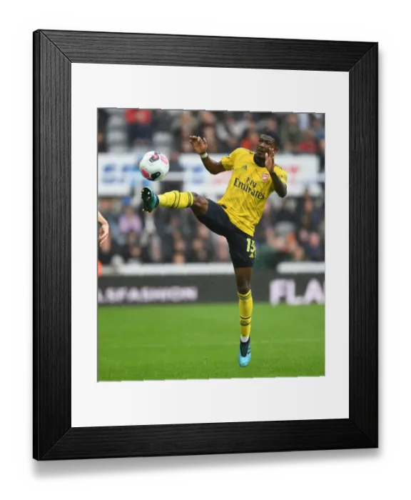 Framed Print : Arsenal's Maitland-Niles in Action Against Newcastle United - Premier League 2019-20