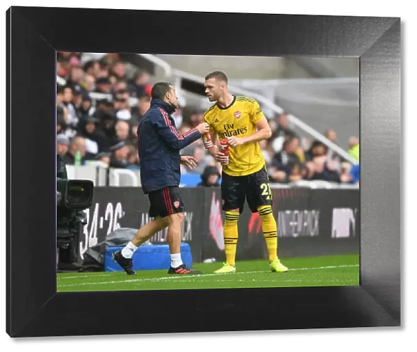 Arsenal Assistant Coach Juan Carlos Carcedo Guides Calum Chambers during Newcastle United vs Arsenal (2019-20)
