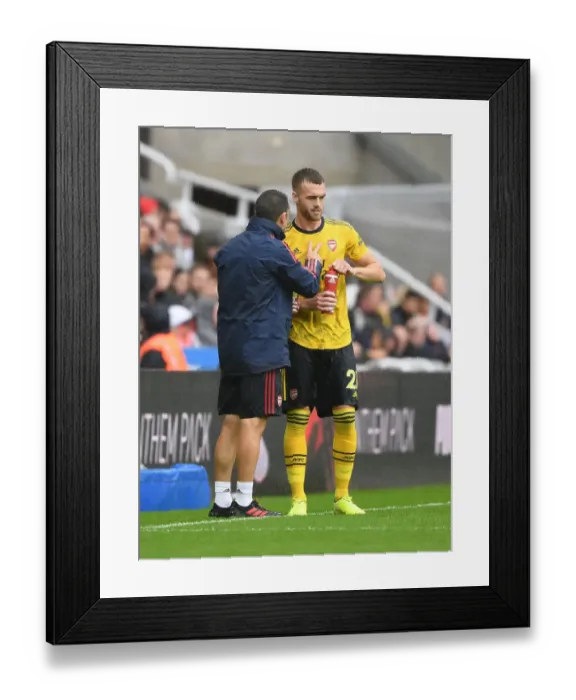 Framed Print : Arsenal's Juan Carlos Carcedo Coaches Calum Chambers during Newcastle United vs Arsenal Match
