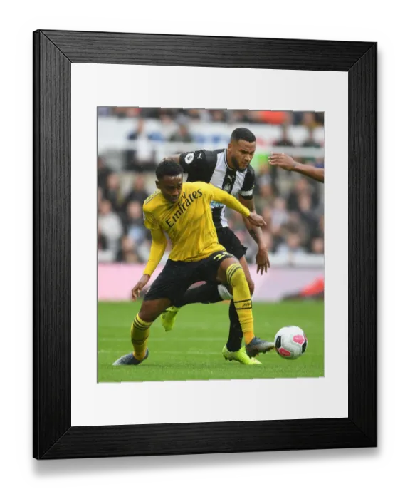Framed Print : Arsenal's Joe Willock vs Newcastle's Jamaal Lascelles: A Premier League Battle at St. James Park Framed Print : Arsenal's Joe Willock vs Newcastle's Jamaal Lascelles: A Premier League Battle at St. James Park