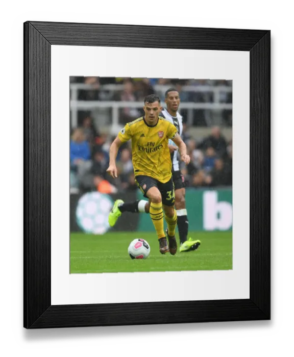 Framed Print : Granit Xhaka in Action: Newcastle United vs. Arsenal FC, Premier League 2019-20