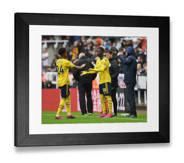 Framed Print : Pepe Replaces Nelson: Arsenal's Substitution in Newcastle United vs Arsenal (2019-20) Framed Print : Pepe Replaces Nelson: Arsenal's Substitution in Newcastle United vs Arsenal (2019-20)