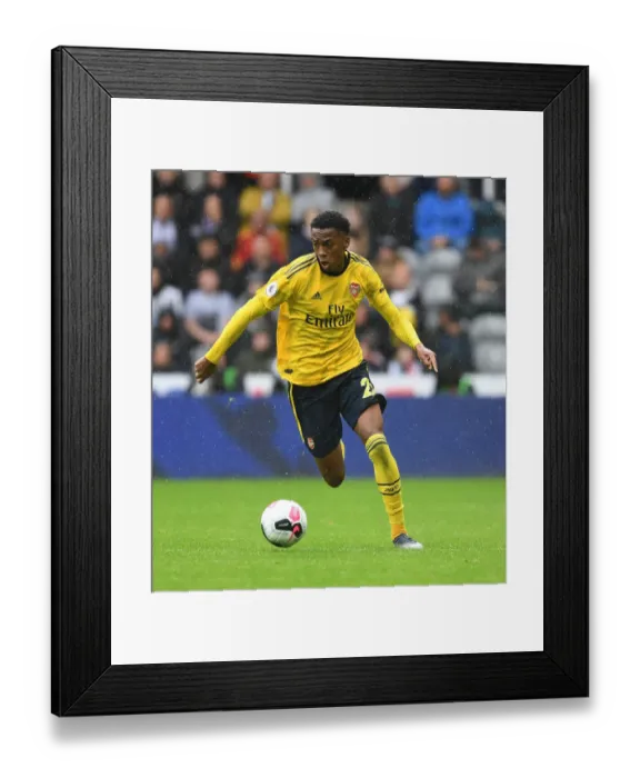Framed Print : Joe Willock in Action: Premier League Battle - Arsenal vs. Newcastle United