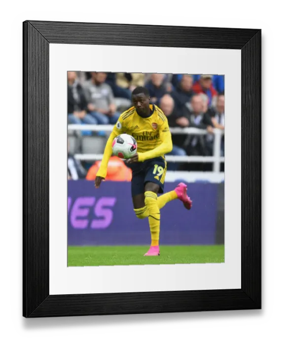 Framed Print : Pepe in Action: Arsenal's Star Winger Dazzles in Newcastle United Showdown, Premier League 2019-20 Framed Print : Pepe in Action: Arsenal's Star Winger Dazzles in Newcastle United Showdown, Premier League 2019-20