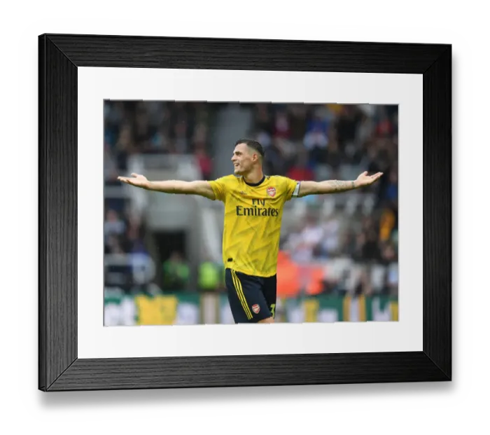 Framed Print : Granit Xhaka's Stellar Midfield Display: Arsenal Secures Victory over Newcastle United