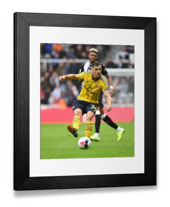 Framed Print : Granit Xhaka in Action: Premier League Battle - Arsenal vs. Newcastle United (2019-20) Framed Print : Granit Xhaka in Action: Premier League Battle - Arsenal vs. Newcastle United (2019-20)