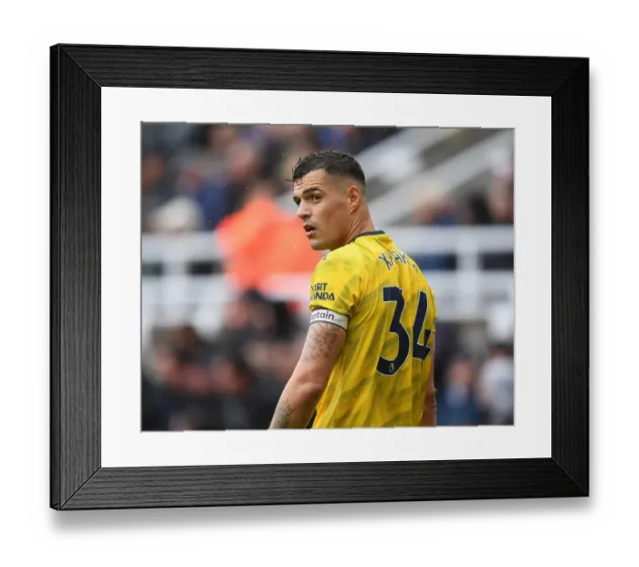 Framed Print : Granit Xhaka: Arsenal's Midfield Maestro Shines in Premier League Battle against Newcastle United