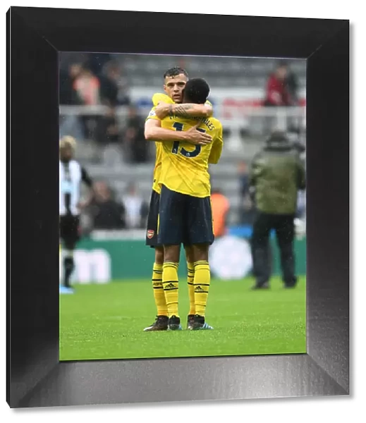 Arsenal's Emotional Victory: Xhaka and Maitland-Niles Embrace Post-Match at Newcastle United