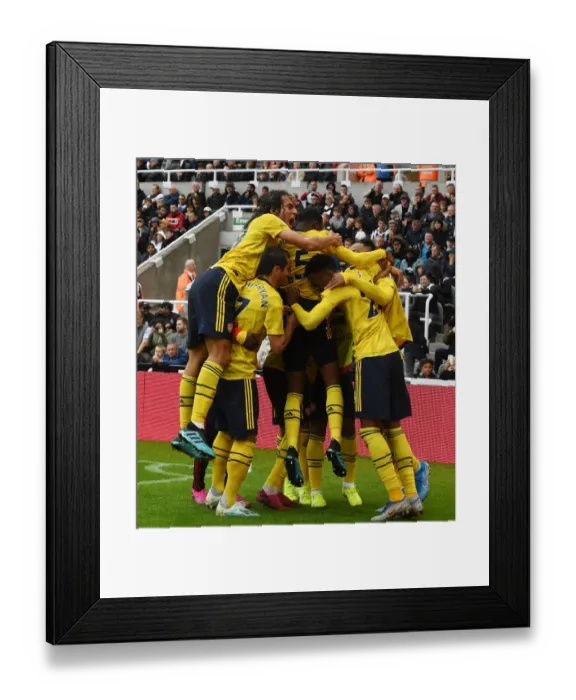 Framed Print : Aubameyang Strikes: Guendouzi and Mkhitaryan Celebrate Arsenal's Winning Goal vs. Newcastle United