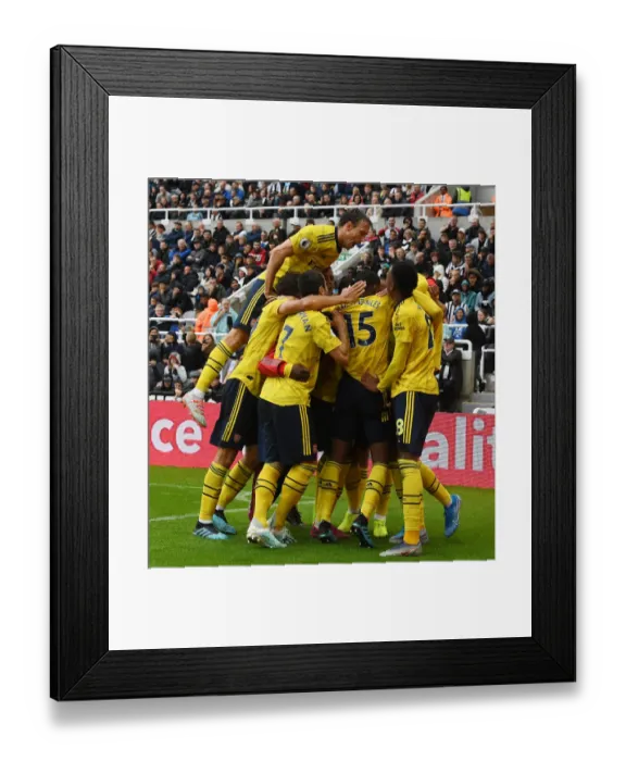 Framed Print : Aubameyang's Stunner: Monreal Celebrates Arsenal's Win at Newcastle United (2019-20)