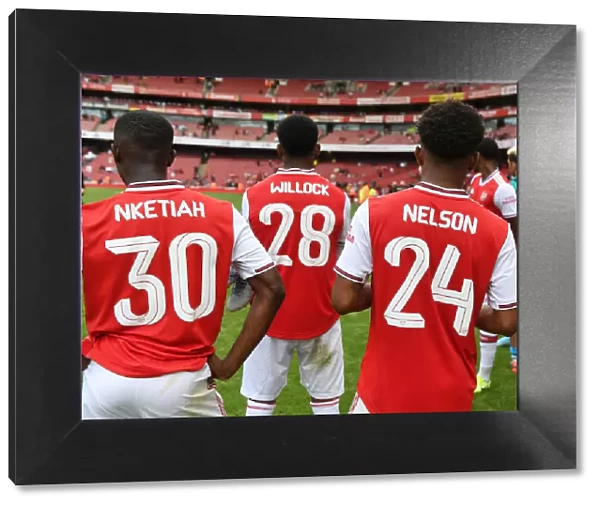 Arsenal's Young Stars: Nketiah, Willock, and Nelson Celebrate Emirates Cup Victory over Olympique Lyonnais