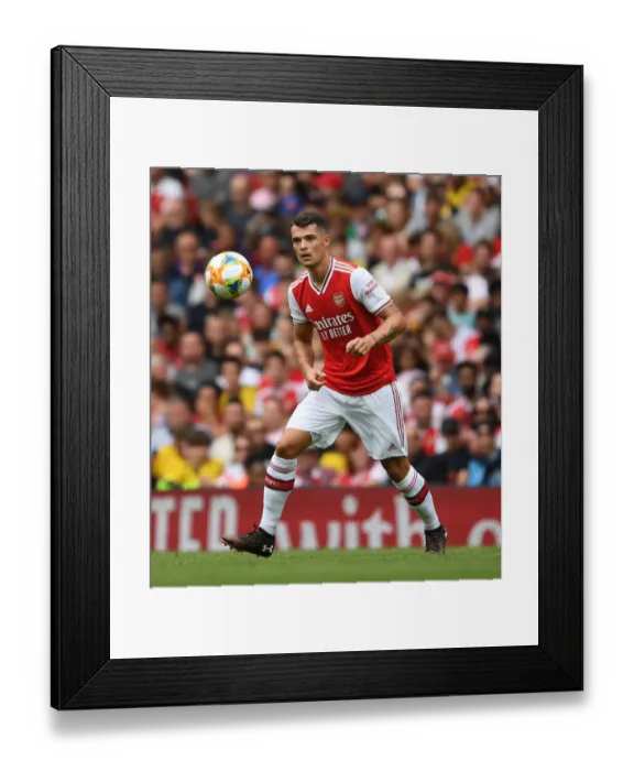 Framed Print : Granit Xhaka: Arsenal's Midfield Maestro Shines in Emirates Cup Clash Against Olympique Lyonnais Framed Print : Granit Xhaka: Arsenal's Midfield Maestro Shines in Emirates Cup Clash Against Olympique Lyonnais