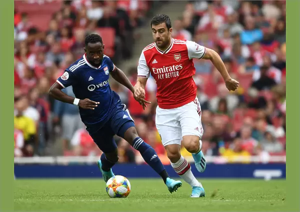 Arsenal vs. Olympique Lyonnais: Sokratis Breaks Past Moussa Dembele at the Emirates Cup