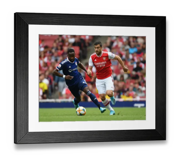 Framed Print : Arsenal vs. Olympique Lyonnais: Sokratis Breaks Past Moussa Dembele at the Emirates Cup