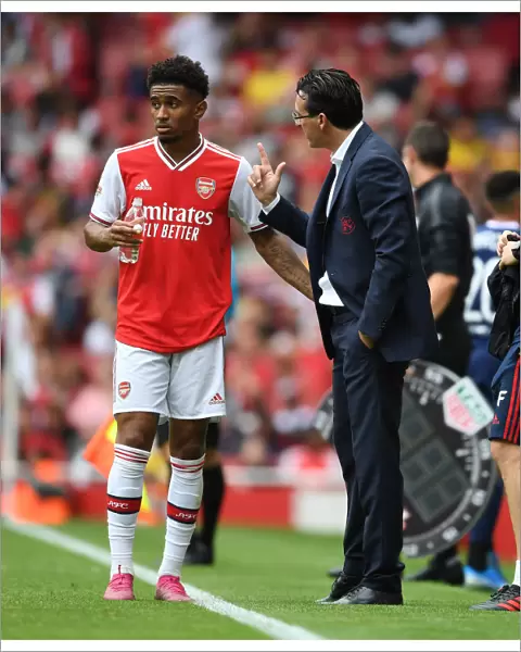 Arsenal's Unai Emery Coaches Reiss Nelson During Emirates Cup Match Against Olympique Lyonnais (2019)