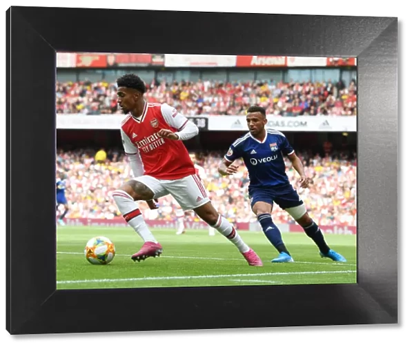 Arsenal vs. Olympique Lyonnais Clash: Reiss Nelson Faces Fernando Marcal at the Emirates Cup, 2019
