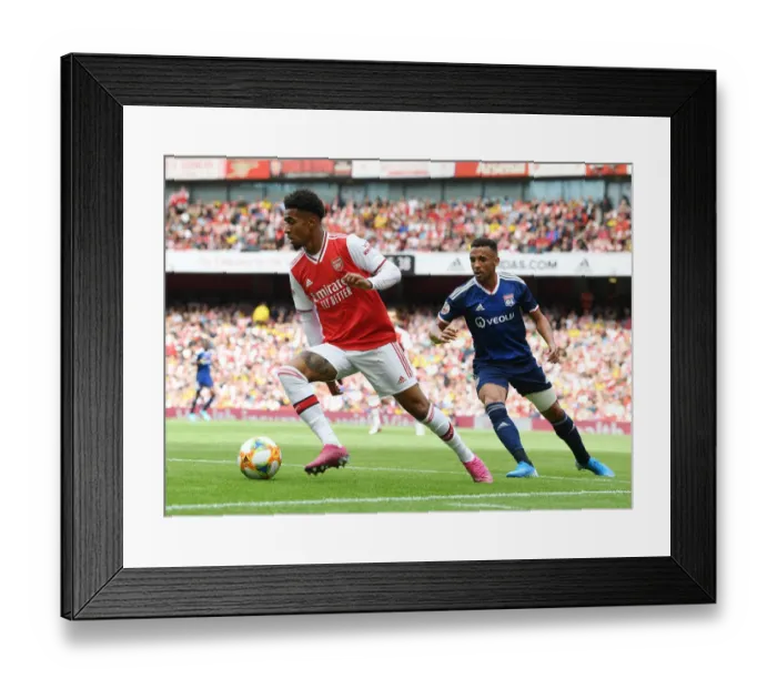Framed Print : Arsenal vs. Olympique Lyonnais Clash: Reiss Nelson Faces Fernando Marcal at the Emirates Cup, 2019