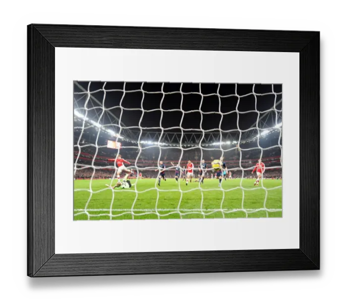 Framed Print : Andrey Arshavin shoots past Bolton goalkeeper Jussi Jskelainen to score the 4th Arsenal goal