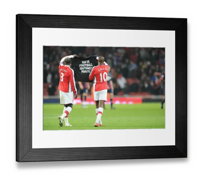 Framed Print : Bacary Sagna and William Gallas (Arsenal) show a tribute to the Haiti victims