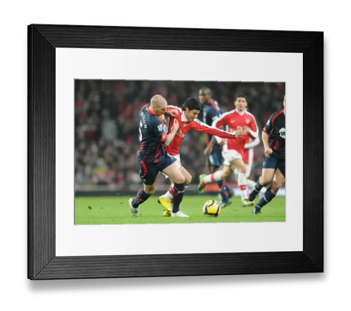 Framed Print : Carlos Vela (Arsenal) Gretar Steinsson (Bolton). Arsenal 4: 2 Bolton Wanderers