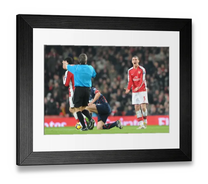 Framed Print : Thomas Vermaelen (Arsenal) argues with referee Alan Wiley. Arsenal 4: 2 Bolton Wanderers Framed Print : Thomas Vermaelen (Arsenal) argues with referee Alan Wiley. Arsenal 4: 2 Bolton Wanderers