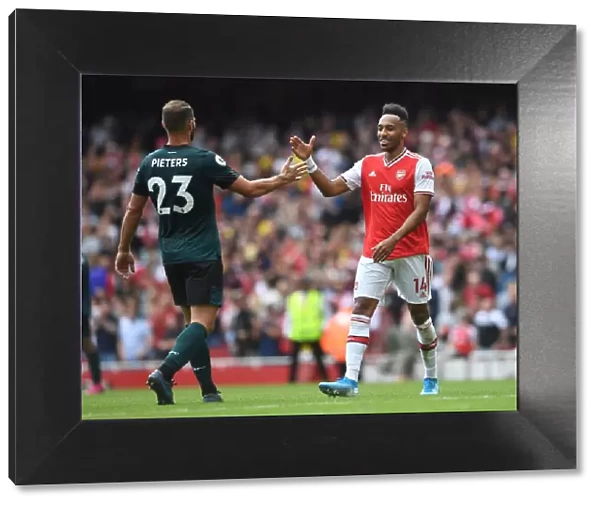 Arsenal's Aubameyang Celebrates with Burnley's Pieters after Intense Arsenal v Burnley Clash (2019-20)