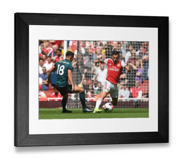 Framed Print : Arsenal's Ceballos Clashes with Burnley's Westwood in Premier League Showdown
