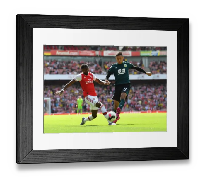 Framed Print : Arsenal vs Burnley: Ainsley Maitland-Niles vs Dwight McNeil Clash in Premier League Showdown