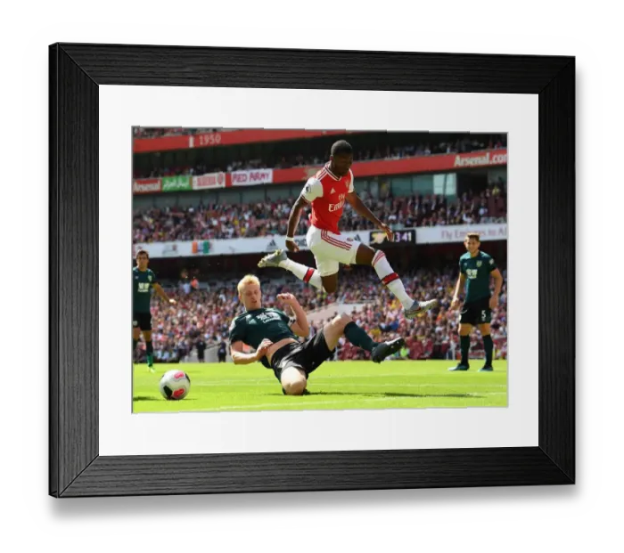 Framed Print : Arsenal vs Burnley: Maitland-Niles Leaps Past Mee in Premier League Clash