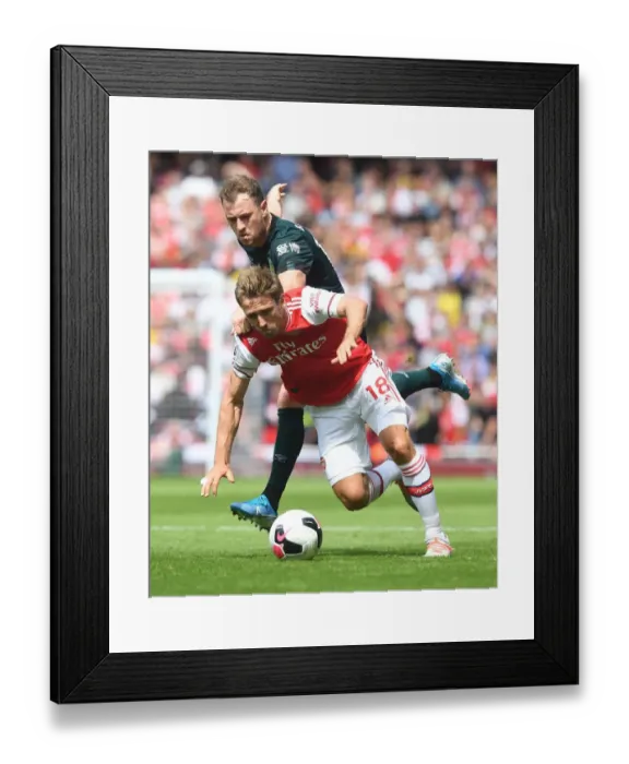 Framed Print : Arsenal vs Burnley: Monreal vs Barnes Clash in Premier League Showdown