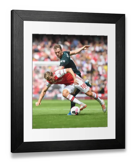 Framed Print : Arsenal's Monreal Clashes with Burnley's Barnes in Premier League Showdown