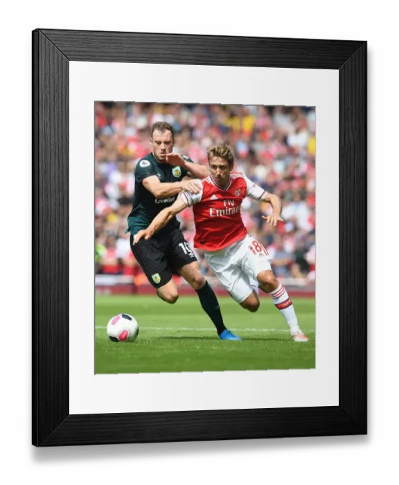 Framed Print : Monreal vs Barnes: A Premier League Showdown at Emirates Stadium