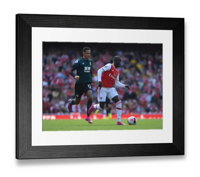 Framed Print : Pepe vs McNeil: Intense Face-Off in Arsenal's Battle Against Burnley