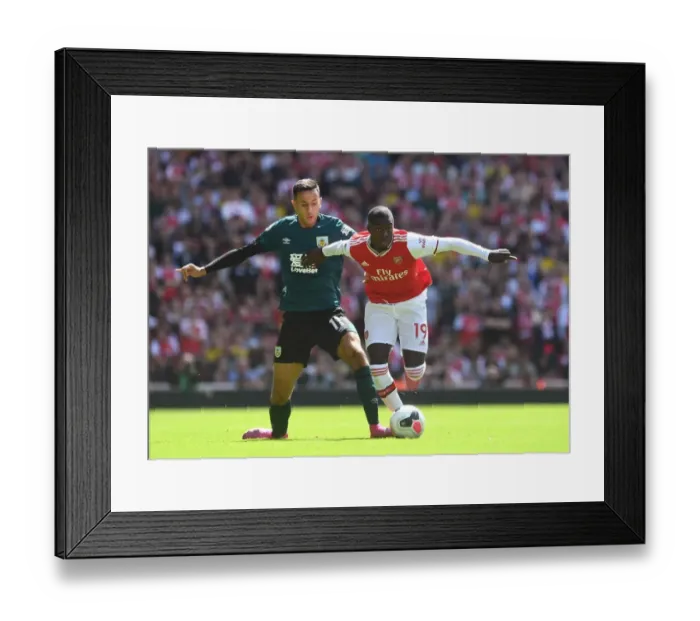 Framed Print : Arsenal's Pepe Clashes with Burnley's McNeil in Premier League Showdown Framed Print : Arsenal's Pepe Clashes with Burnley's McNeil in Premier League Showdown