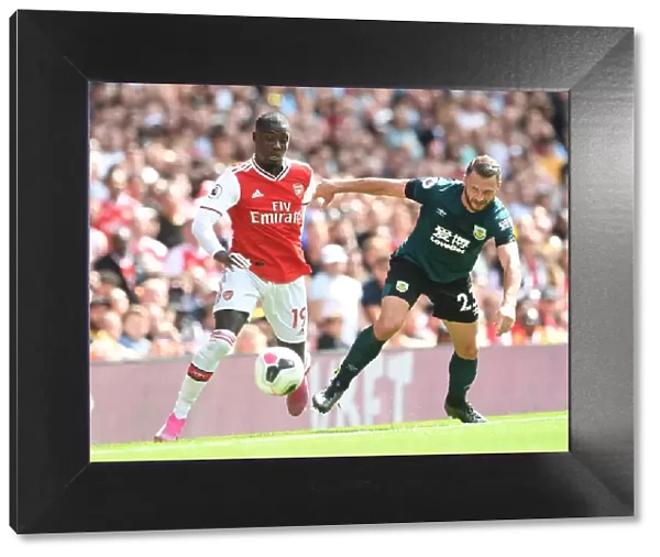 Arsenal's Nicolas Pepe Faces Off Against Burnley's Erik Pieters in 2019-20 Premier League Clash