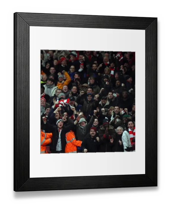 Framed Print : Arsenal fans celebrate the 3rd goal. Arsenal 4: 2 Bolton Wanderers. Barclays Premier League Framed Print : Arsenal fans celebrate the 3rd goal. Arsenal 4: 2 Bolton Wanderers. Barclays Premier League