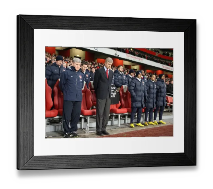 Framed Print : Arsene Wenger the Arsenal Manager and the subs bench bow their heads for a minutes silence for the Haiti disaster. Arsenal 4: 2 Bolton Wanderers. Barclays Premier League. Emirates Stadium, 20 / 1 / 10. Credit : Arsenal Football Club Framed Print : Arsene Wenger the Arsenal Manager and the subs bench bow their heads for a minutes silence for the Haiti disaster. Arsenal 4: 2 Bolton Wanderers. Barclays Premier League. Emirates Stadium, 20 / 1 / 10. Credit : Arsenal Football Club