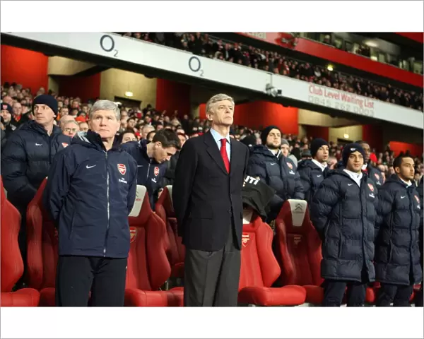 Arsene Wenger the Arsenal Manager and Pat Rice his Assistant satnd for a minutes silence following the disater in Haiti. Arsenal 4: 2 Bolton Wanderers. Barclays Premier League. Emirates Stadium, 20  /  1  /  10. Credit : Arsenal Football Club