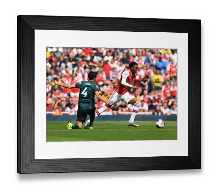 Framed Print : Arsenal's Joe Willock Outwits Jack Cork: A Premier League Battle at Emirates Stadium