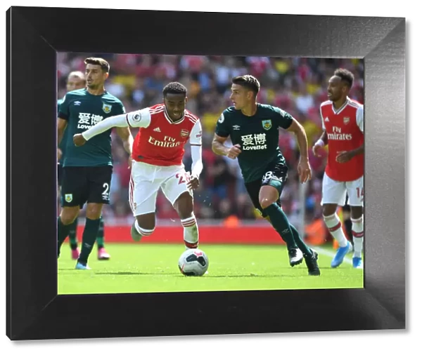 Intense Rivalry: Joe Willock vs. Ashley Westwood Clash in Arsenal vs. Burnley Premier League Match