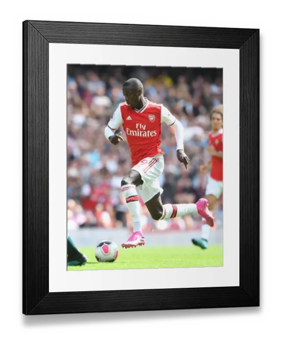 Framed Print : Arsenal's Nicolas Pepe in Action: Premier League Showdown against Burnley, 2019-20